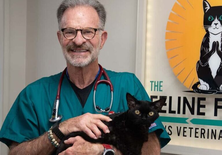Dr. Randy holding a cat